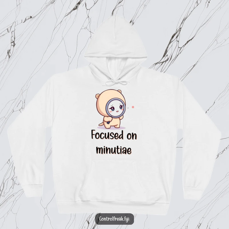 Funny hoodie showing a tiny character intensely scrutinizing a dot with a magnifying glass, symbolizing deep concentration.